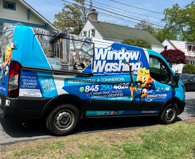 Brightness window cleaning van parked on customers property for window cleaning service. 